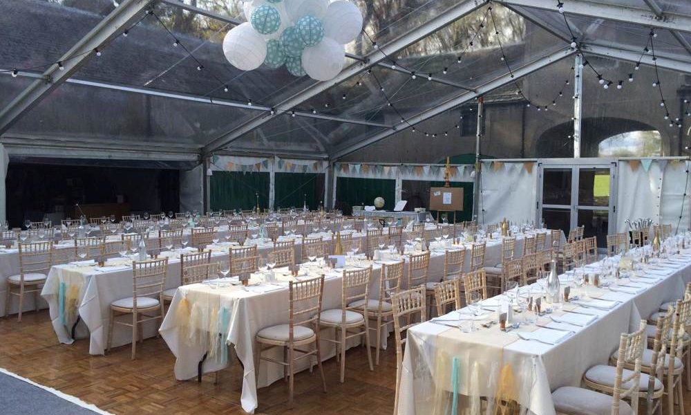 Furniture - Trestle tables in courtyard marquee